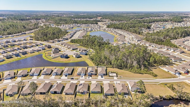 bird's eye view featuring a residential view and a water view