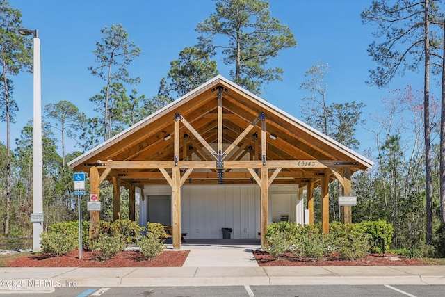 surrounding community with a carport and driveway