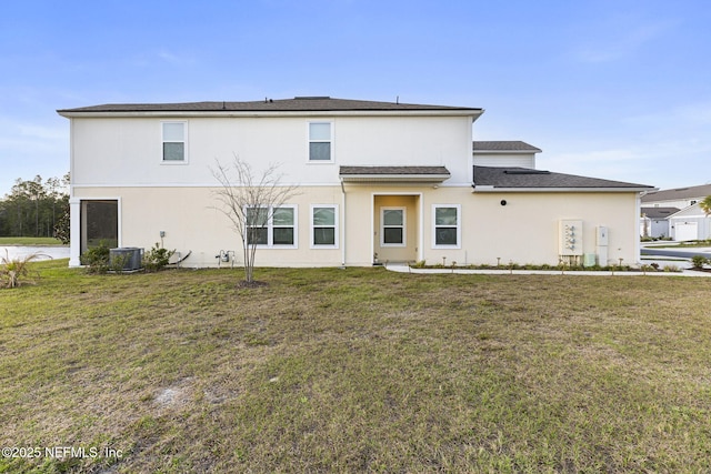 439 Coastline Way, Saint Augustine, FL 32092 - rear view of property with stucco siding, a yard, and central AC unit
