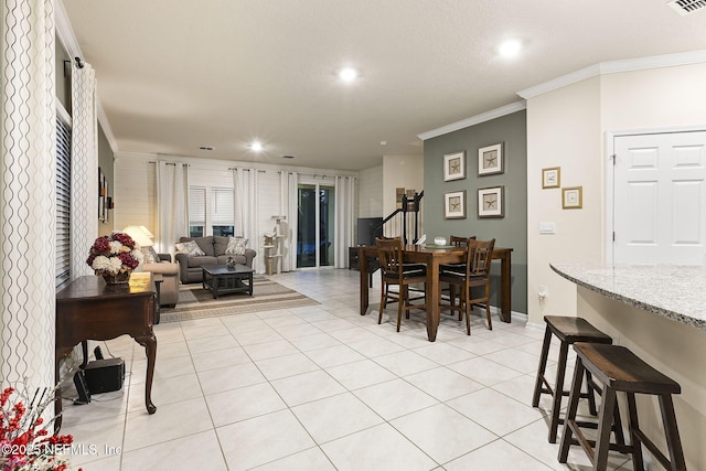 439 Coastline Way, Saint Augustine, FL 32092 - dining area with ornamental molding, visible vents, baseboards, and light tile patterned floors