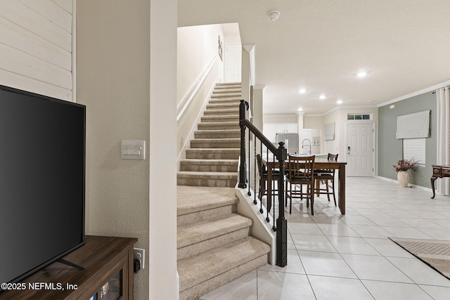 439 Coastline Way, Saint Augustine, FL 32092 - dining room with light tile patterned floors, baseboards, stairway, crown molding, and recessed lighting
