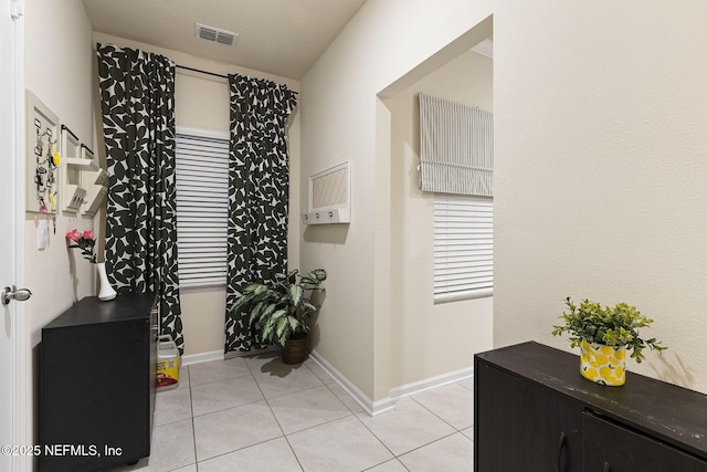 439 Coastline Way, Saint Augustine, FL 32092 - hallway featuring visible vents, baseboards, and light tile patterned floors
