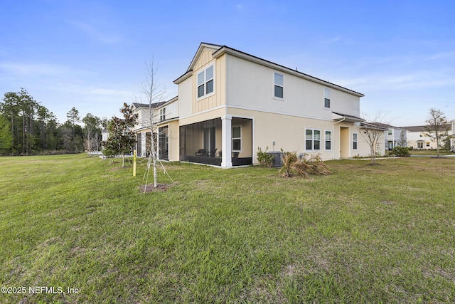 439 Coastline Way, Saint Augustine, FL 32092 - rear view of property with a lawn, cooling unit, and a sunroom
