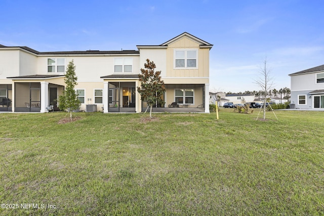 439 Coastline Way, Saint Augustine, FL 32092 - back of property featuring a yard, board and batten siding, a sunroom, and central air condition unit
