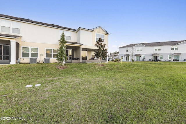 439 Coastline Way, Saint Augustine, FL 32092 - back of property with central air condition unit, stucco siding, and a yard