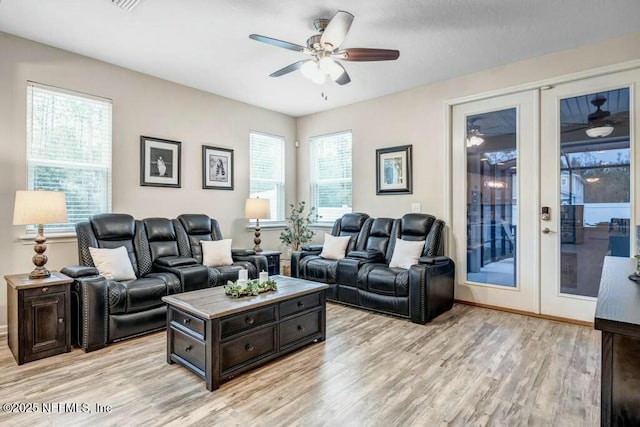 6743 Summit Vista Ct, Jacksonville, FL 32259 - living area with french doors, ceiling fan, and light wood-style flooring