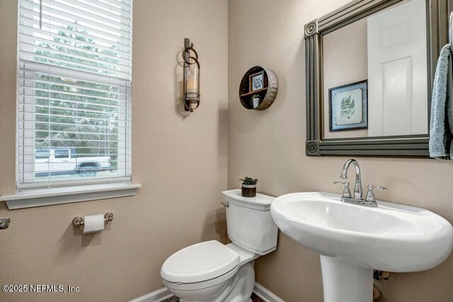 6743 Summit Vista Ct, Jacksonville, FL 32259 - bathroom with baseboards, a sink, and toilet