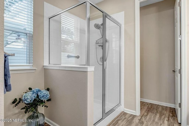 6743 Summit Vista Ct, Jacksonville, FL 32259 - bathroom with a stall shower, baseboards, and wood finished floors