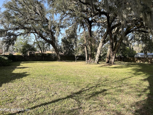 view of yard featuring fence