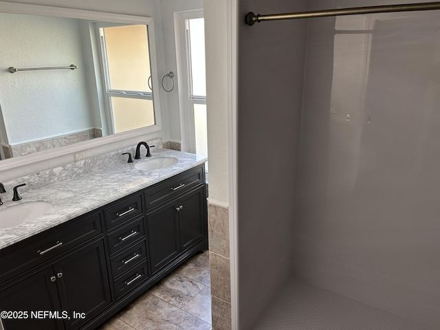 bathroom featuring double vanity and a sink