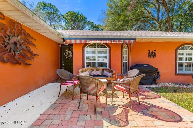 view of patio featuring area for grilling and an outdoor hangout area