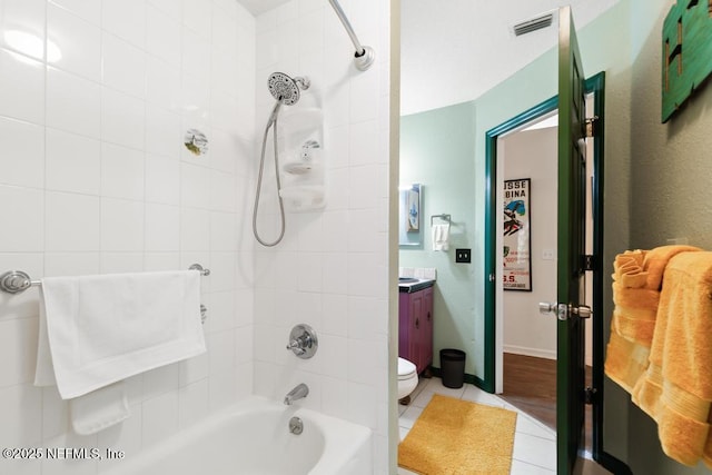 bathroom featuring vanity, shower / bathing tub combination, tile patterned flooring, and visible vents