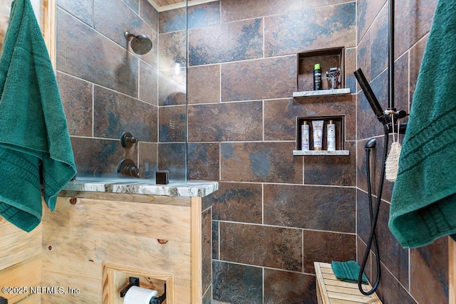 bathroom with a walk in shower