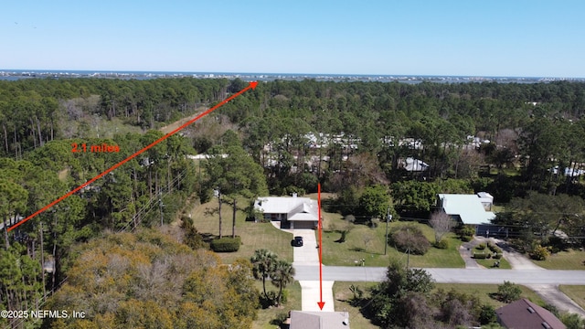 drone / aerial view with a forest view