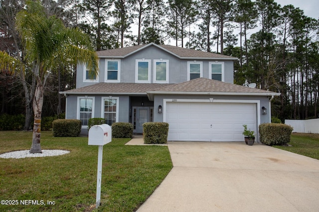 traditional home featuring concrete driveway, a front yard, roof with shingles, stucco siding, and an attached garage