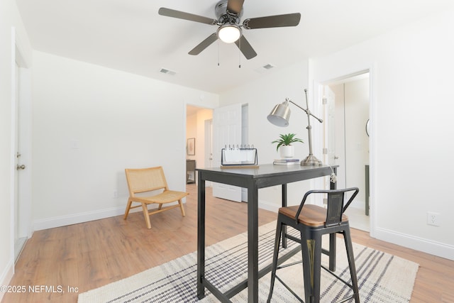 office area featuring visible vents, ceiling fan, light wood-style flooring, and baseboards