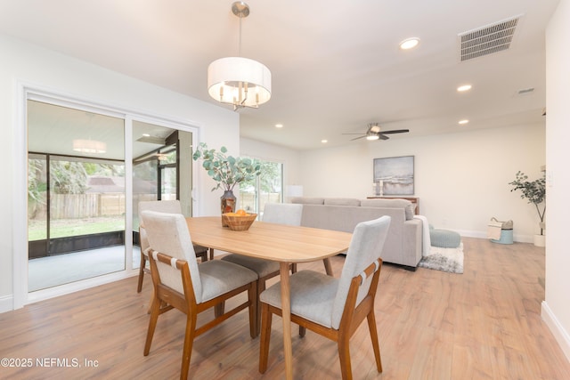 dining area featuring recessed lighting, visible vents, light wood-style flooring, and baseboards