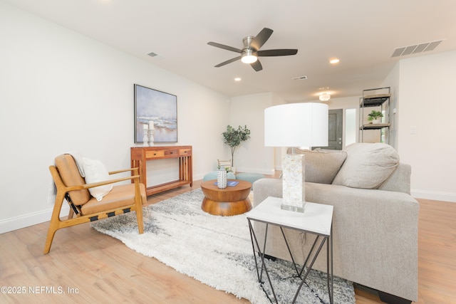 living area with ceiling fan, recessed lighting, wood finished floors, visible vents, and baseboards