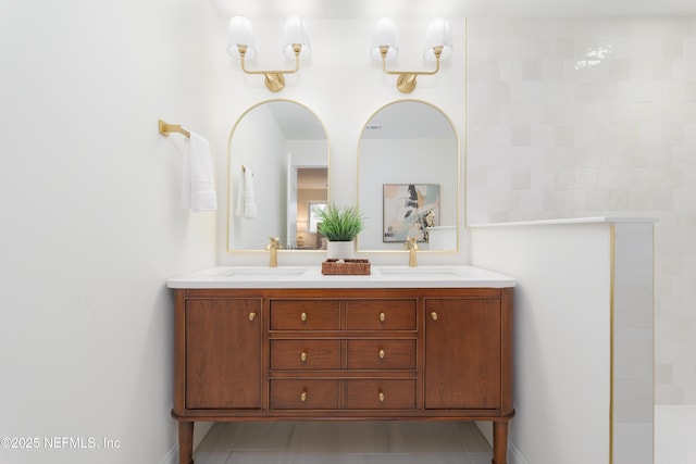 bathroom featuring double vanity and a sink