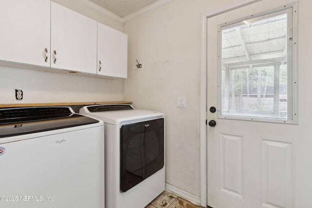 clothes washing area with ornamental molding, baseboards, cabinet space, and washing machine and clothes dryer