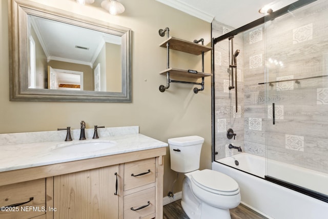 bathroom with bath / shower combo with glass door, visible vents, toilet, ornamental molding, and vanity