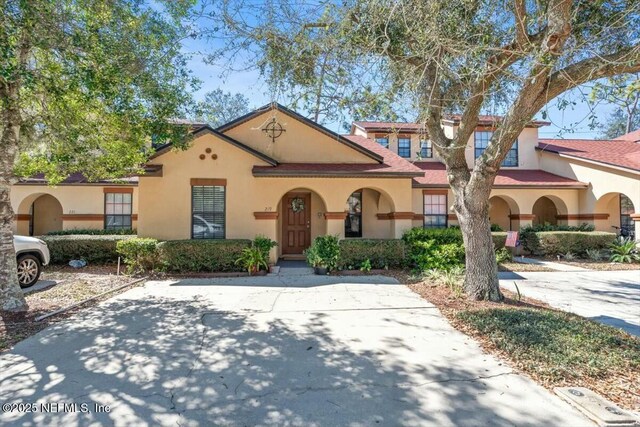 mediterranean / spanish-style house with stucco siding