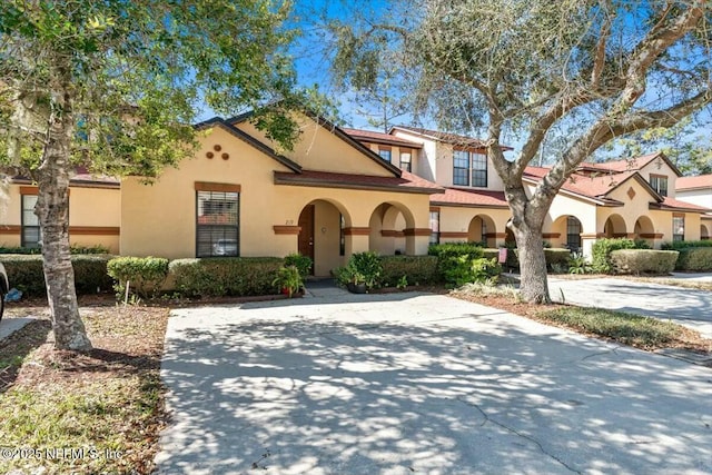 mediterranean / spanish home with stucco siding