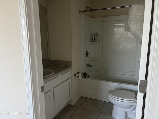 bathroom featuring vanity, tub / shower combination, tile patterned flooring, and toilet