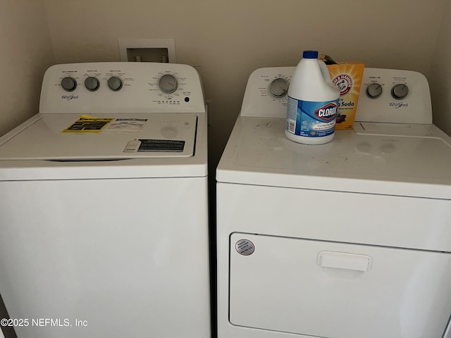 washroom with laundry area and washing machine and clothes dryer