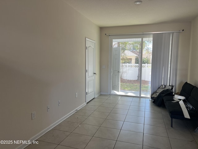 entryway featuring light tile patterned floors and baseboards