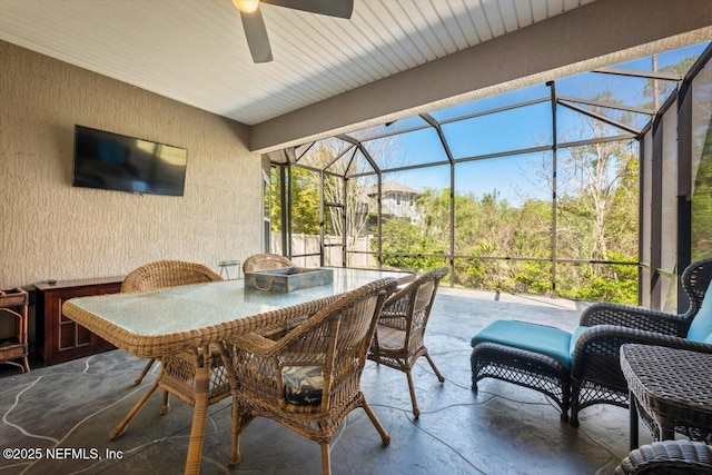 view of patio / terrace with glass enclosure and ceiling fan