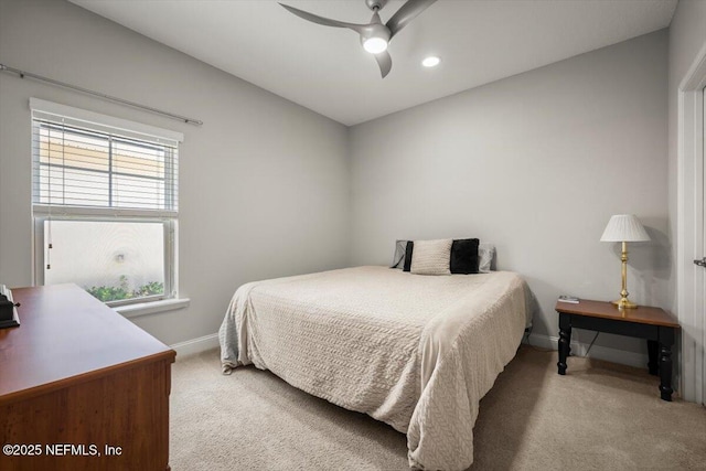 bedroom with recessed lighting, a ceiling fan, baseboards, and light carpet