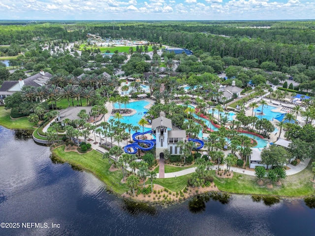 birds eye view of property featuring a view of trees and a water view