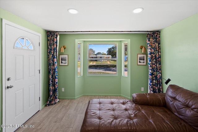 entryway with recessed lighting, baseboards, and light wood-style flooring