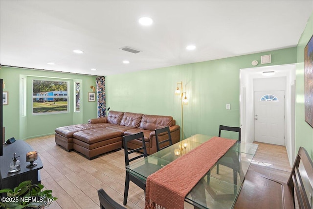 dining space featuring recessed lighting, visible vents, and light wood-type flooring