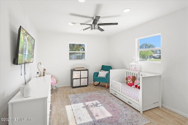 bedroom with recessed lighting, baseboards, wood finished floors, and a ceiling fan