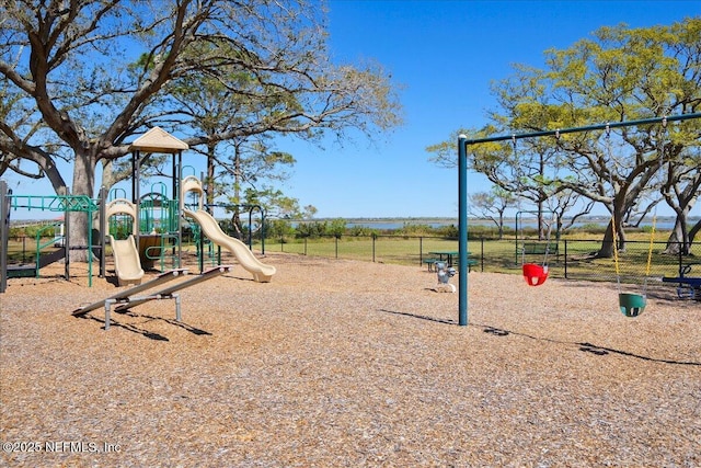 community jungle gym featuring fence