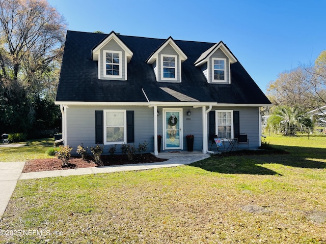 view of front of property featuring covered porch and a front yard