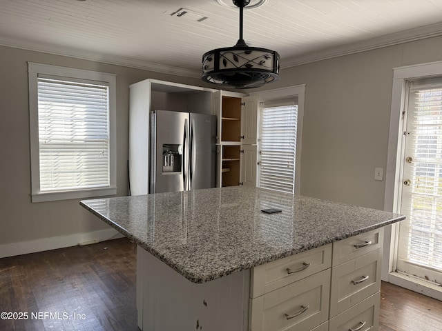 kitchen featuring ornamental molding, white cabinets, dark wood finished floors, and stainless steel fridge with ice dispenser