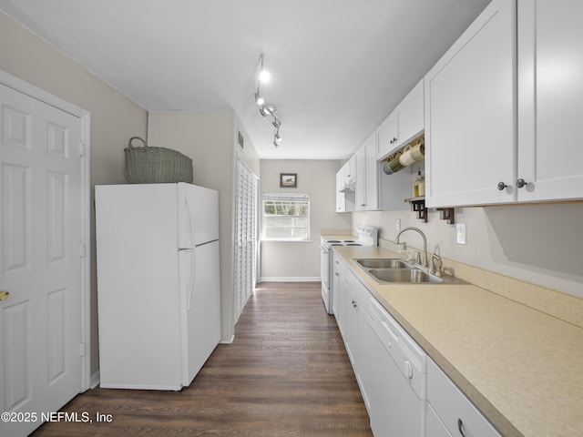 kitchen featuring white appliances, dark wood-style flooring, light countertops, white cabinetry, and a sink