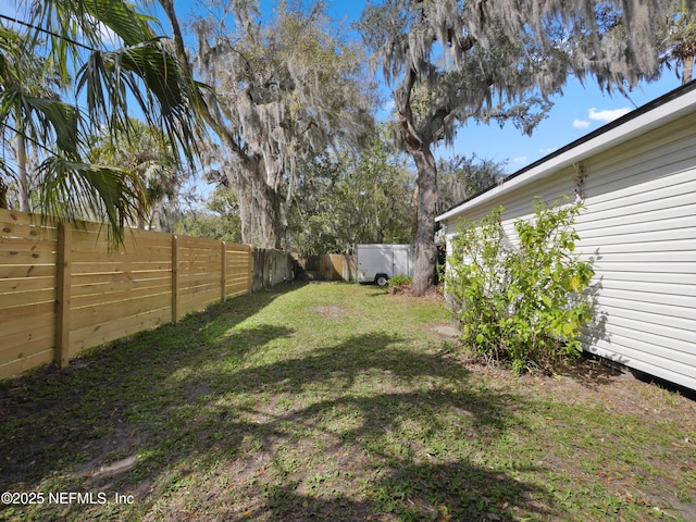 view of yard with a fenced backyard