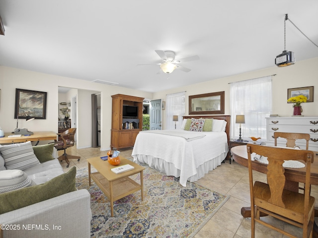 bedroom featuring visible vents, ceiling fan, and light tile patterned floors