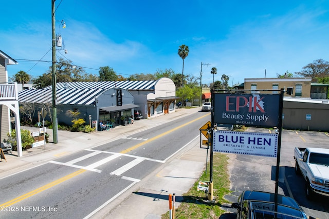 view of road featuring sidewalks and curbs