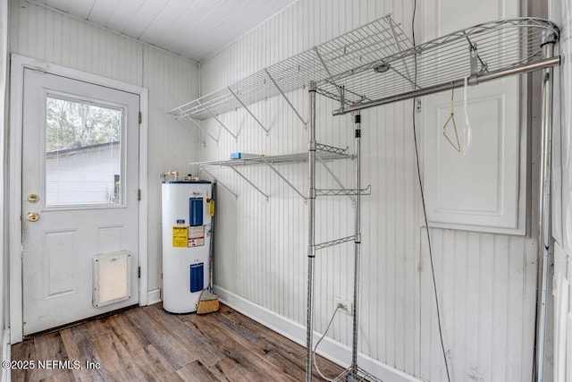 utility room with electric water heater