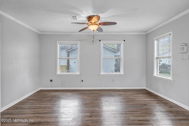 empty room featuring baseboards, wood finished floors, a ceiling fan, and crown molding