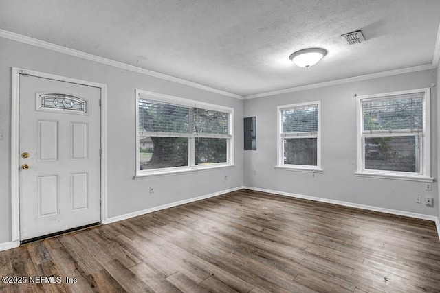 entrance foyer with crown molding, a textured ceiling, and wood finished floors