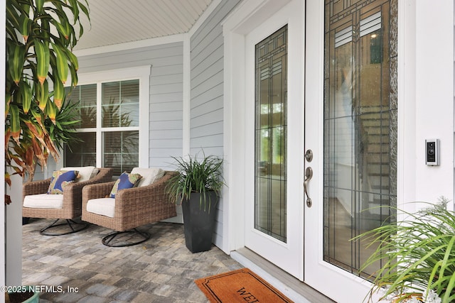 doorway to property with french doors and covered porch