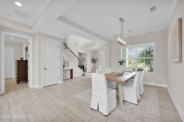 dining area with stairs, baseboards, visible vents, and an inviting chandelier