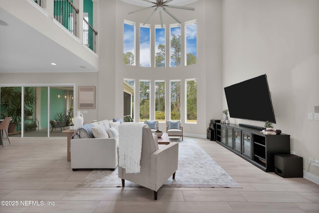 living area with wood tiled floor and baseboards