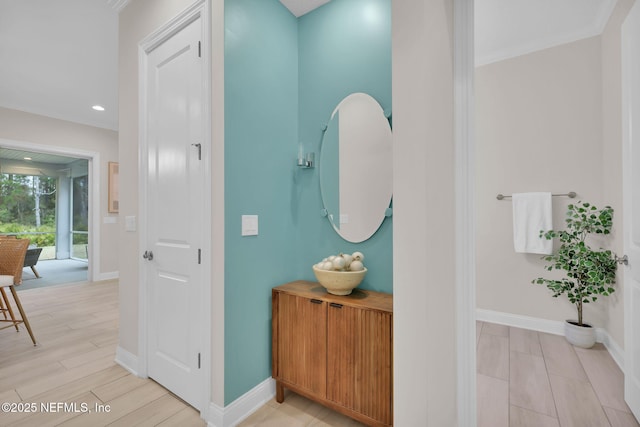 interior space with wood tiled floor, crown molding, baseboards, and recessed lighting